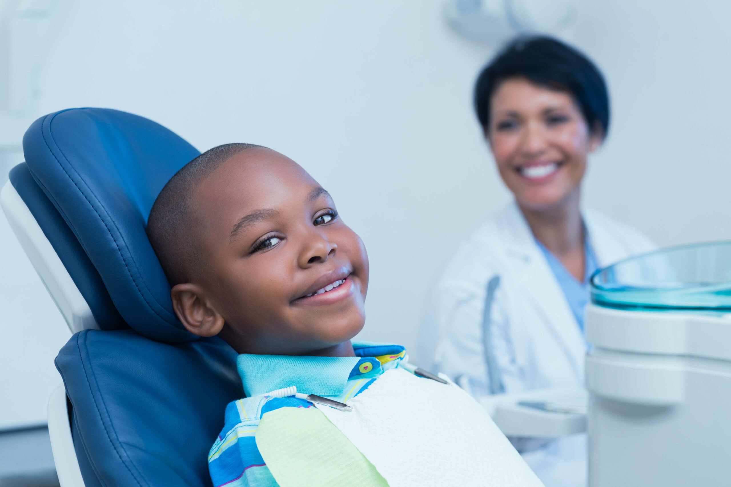 Smiling boy waiting for a dental exam in Chicago