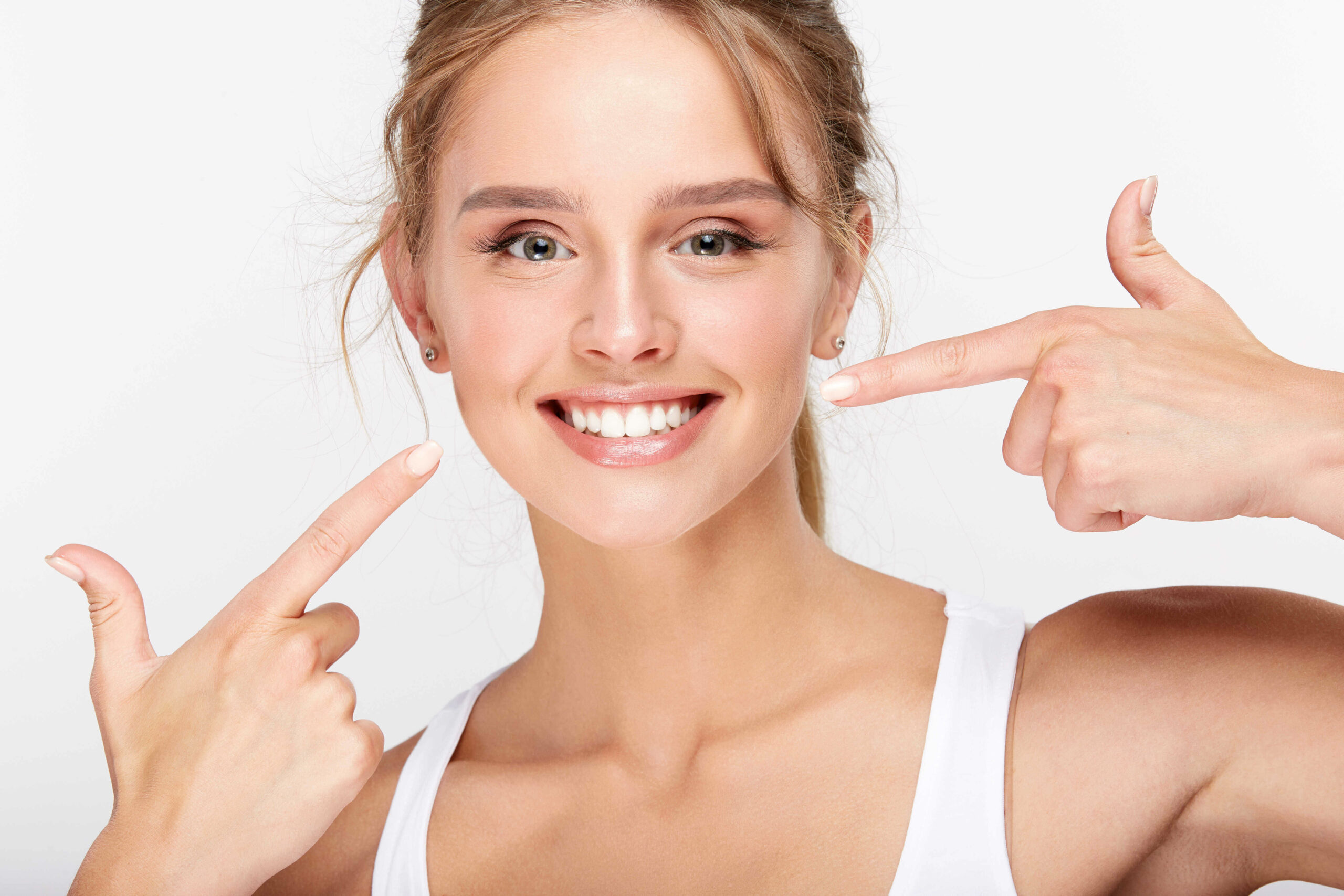 Beautiful smiling woman showing white teeth, dentistry concept in Chicago
