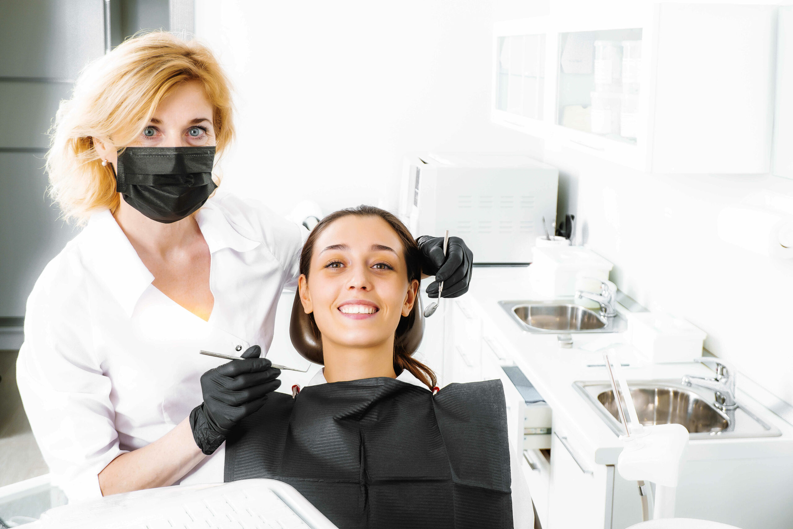 Dentist doctor and patient at the dentistry clinic in Chicago