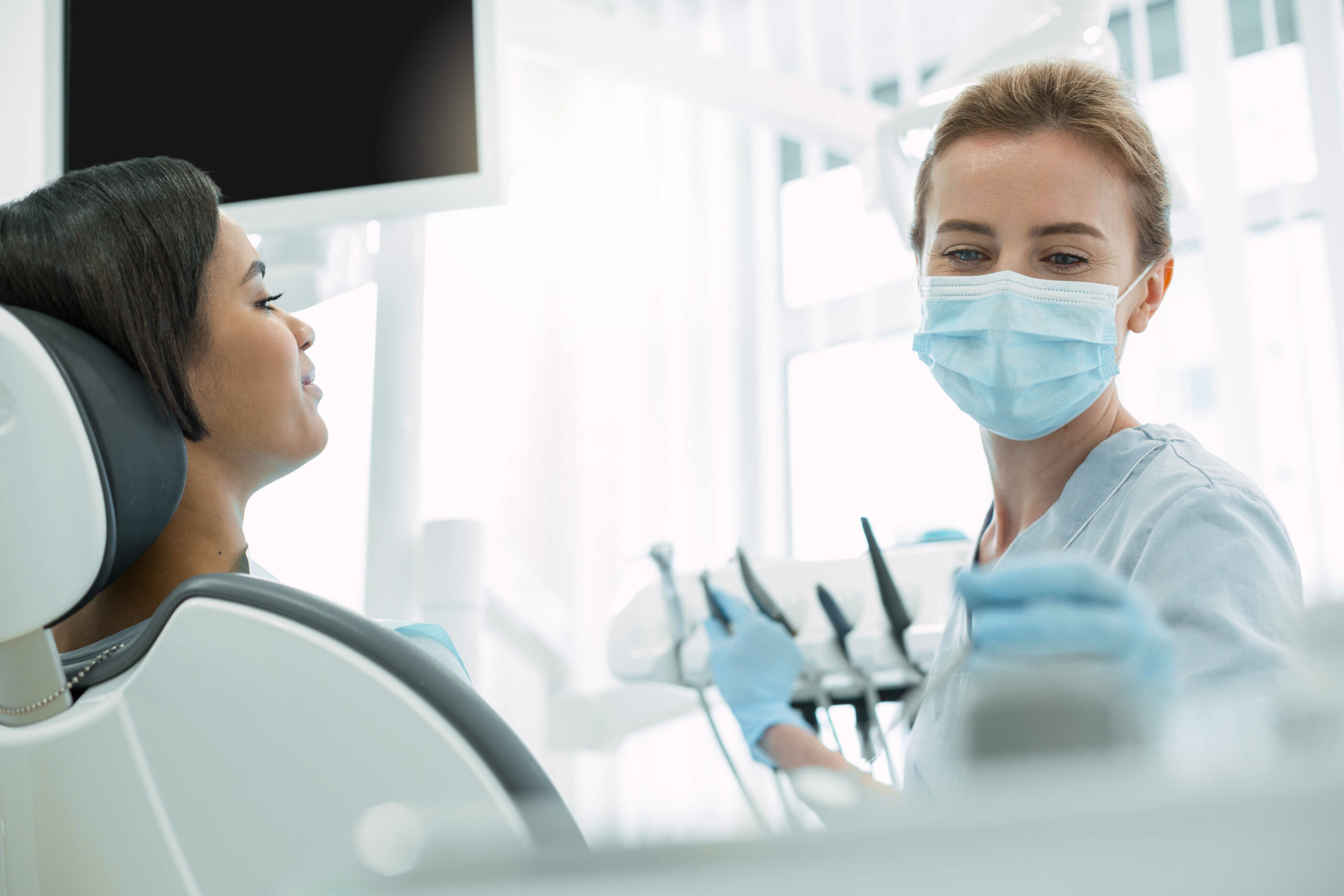 Inspired dentist working with her patient in Chicago